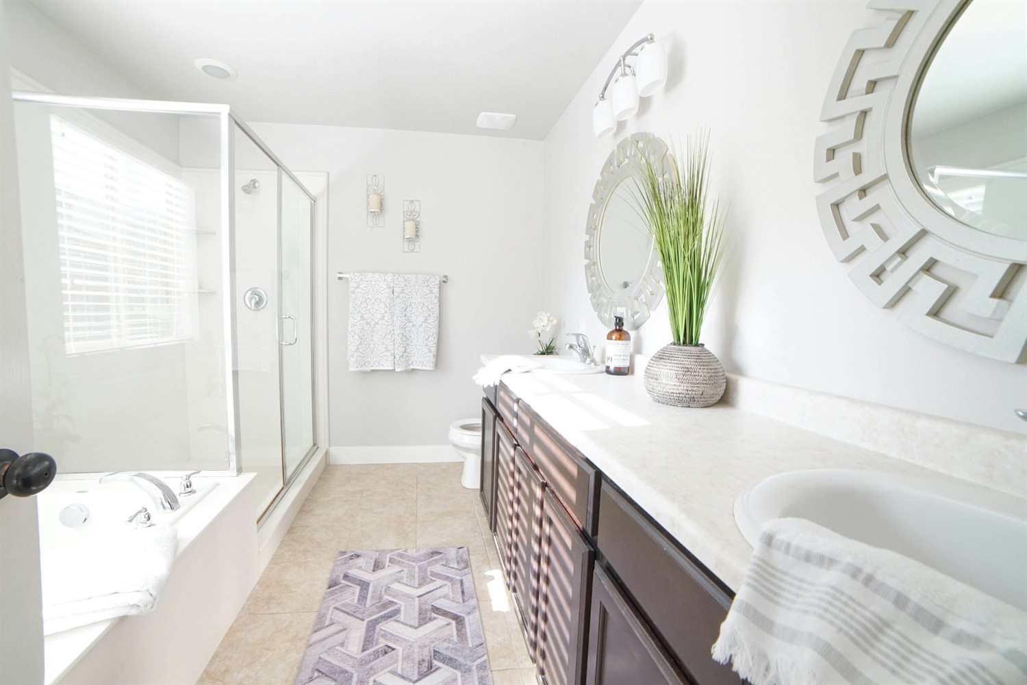 Bright bathroom sink and tub detail